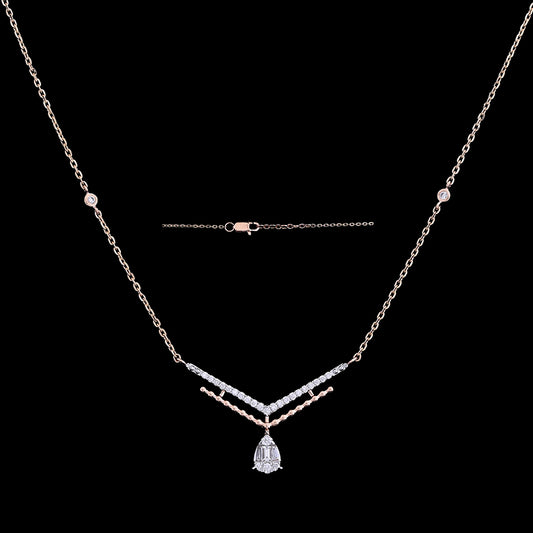 Delicate silver-toned necklace with geometric accents and a teardrop pendant, offering a blend of grace and modern flair. Make an elegant statement with jnjbymadhuri sophistication.