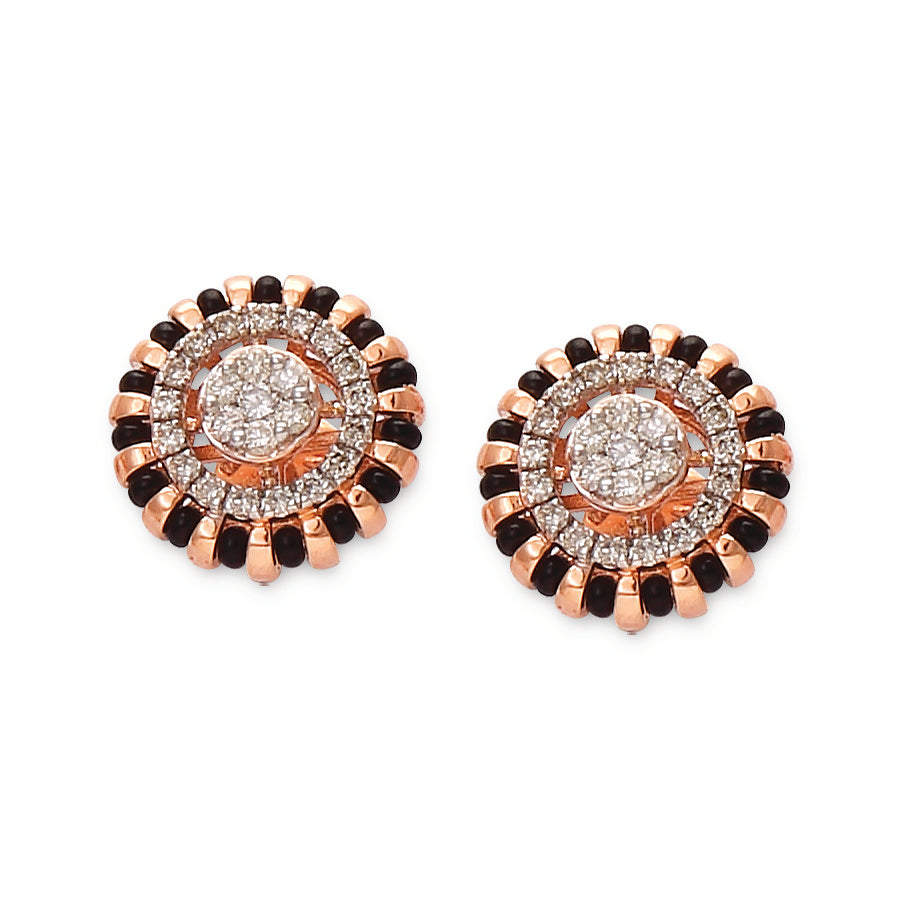 Stunning circular earrings featuring concentric layers of black and white stones with a radiant diamond center. A bold statement design by jnjbymadhuri.