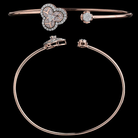 Elegant rose gold bangle featuring a clustered floral design and a sparkling stone accent, crafted with finesse by jnjbymadhuri.