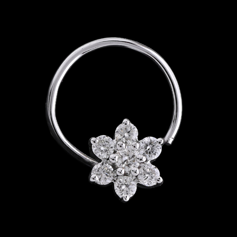 Elegant nose ring featuring a sparkling six-petal diamond flower design, perfect for adding a delicate shine. A graceful statement piece by jnjbymadhuri crafted for refined beauty.