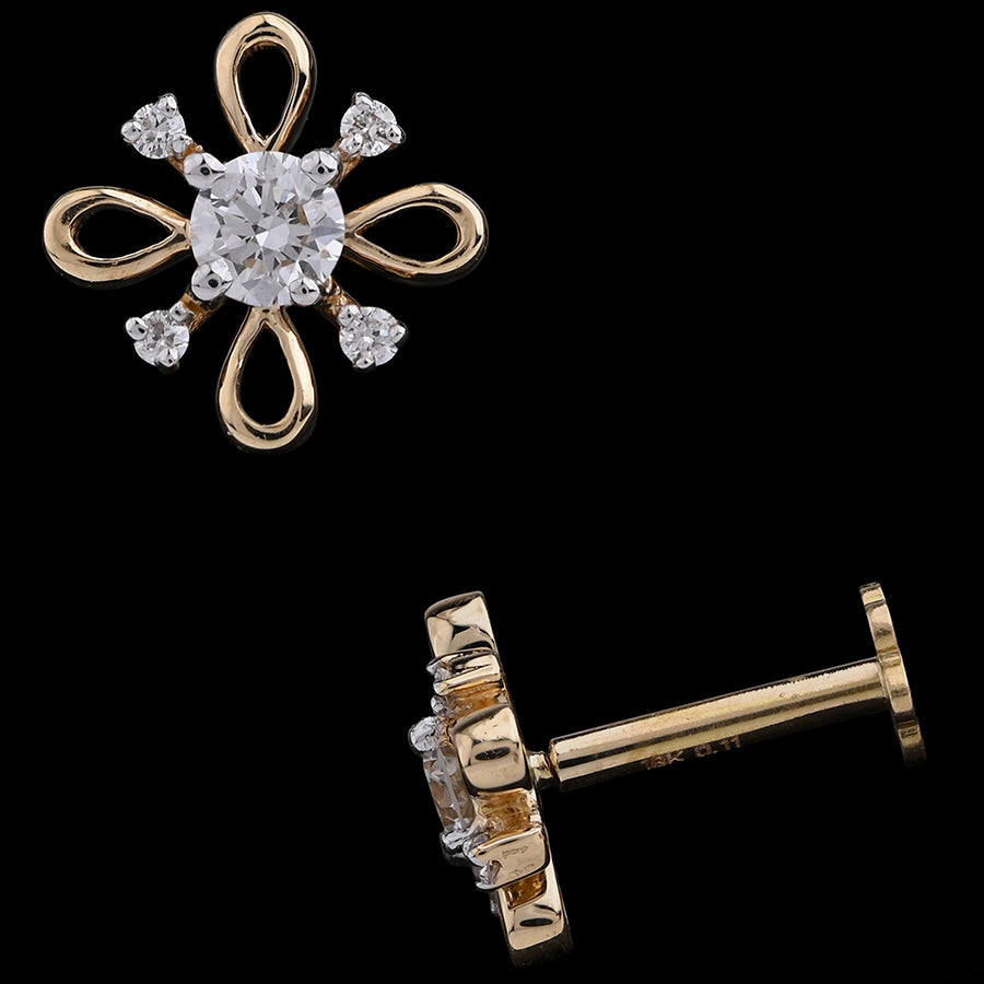 This elegant piece features a floral-inspired design with graceful gold loops and dazzling diamonds at each petal tip, centered by a brilliant round diamond. A refined and artistic earring from jnjbymadhuri, blending modern flair with classic charm.