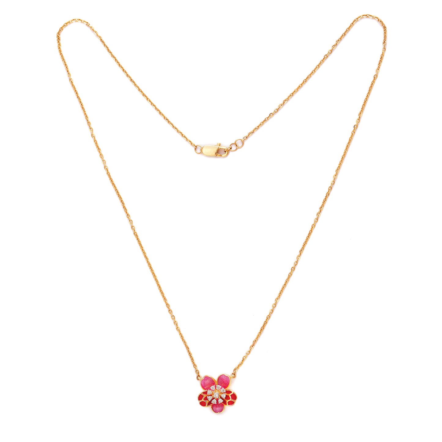 Delicate gold necklace by jnjbymadhuri featuring a floral pendant adorned with red and pink stones, displayed on a white background.