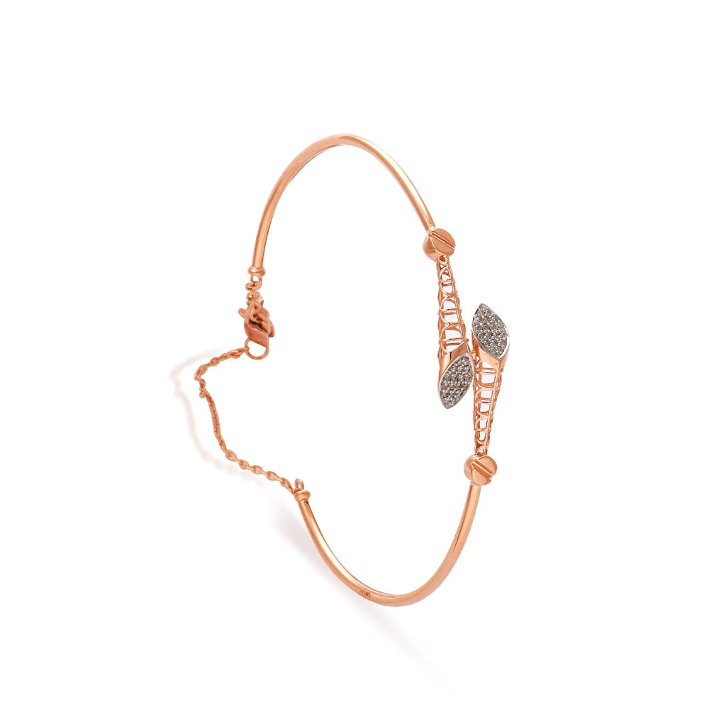 Delicate rose gold bracelet by jnjbymadhuri showcasing a contemporary open design with abstract geometric motifs and shimmering diamond accents, creating a graceful blend of elegance and modern flair.