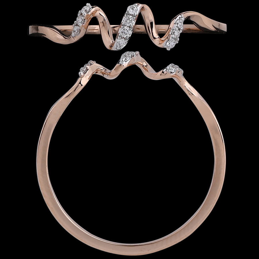 A wavy rose gold ring with scattered diamonds, creating a rhythmic, contemporary silhouette. An artistic and modern design by jnjbymadhuri.