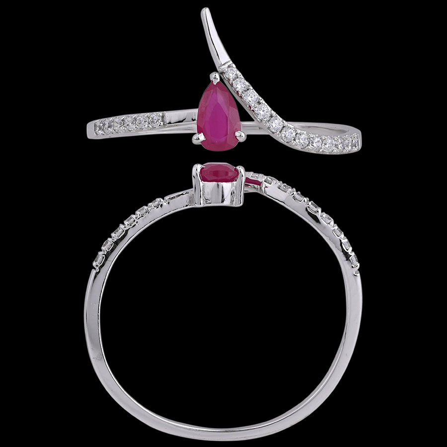 Elegant ruby teardrop ring set in a sleek silver band with delicate diamonds, showcasing refined grace by jnjbymadhuri.