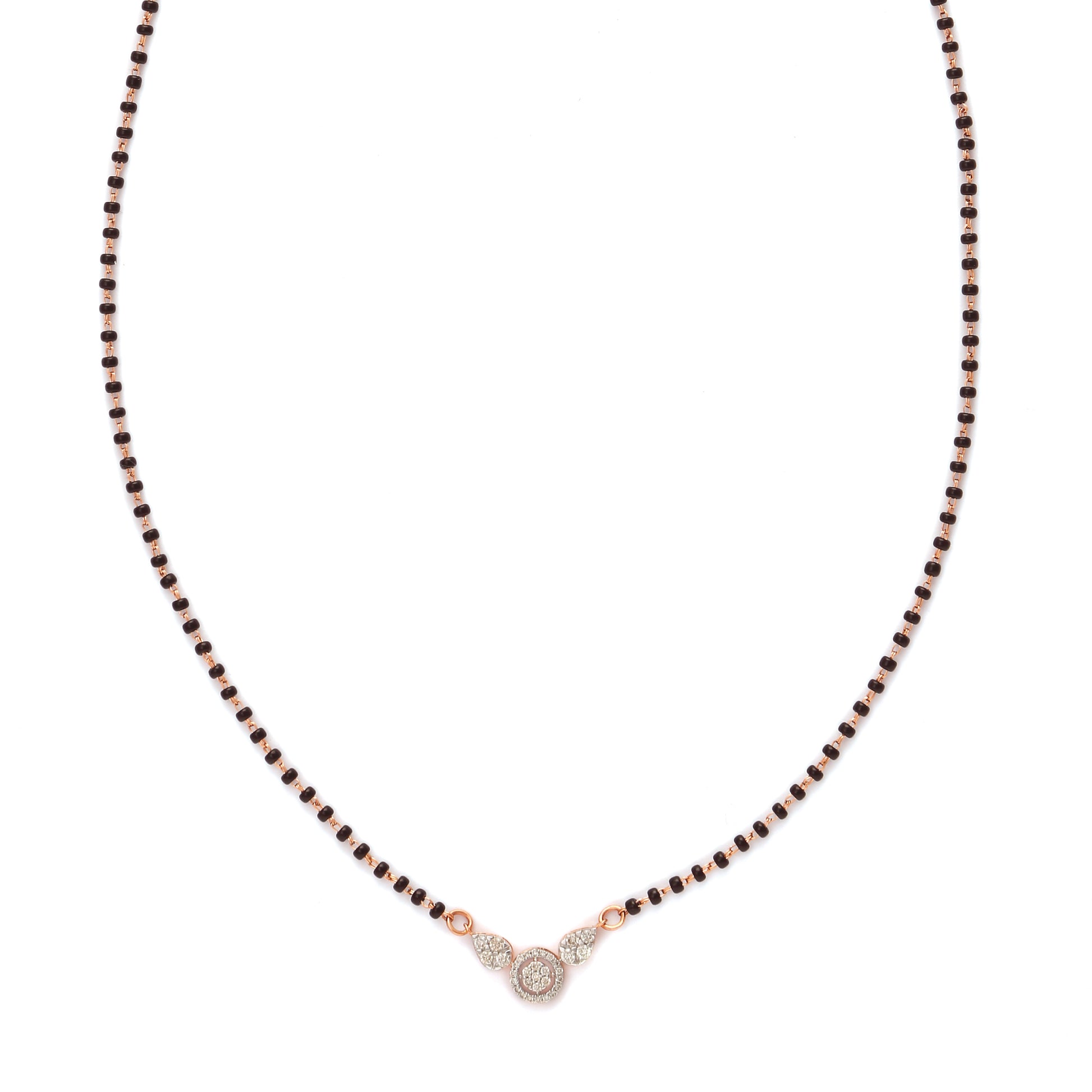 A modern take on tradition—this mangalsutra features a delicate black beaded chain with a minimalist diamond pendant at its center. A graceful and meaningful piece by jnjbymadhuri.