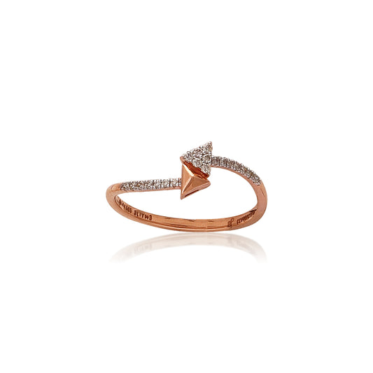 A sleek rose gold ring featuring a geometric arrowhead design adorned with diamonds. This chic and edgy piece reflects the bold elegance of jnjbymadhuri.