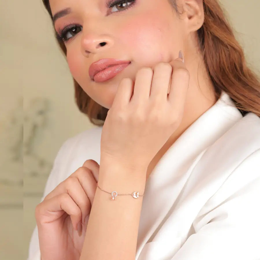 A graceful model showcasing a dainty heart-themed bracelet by jnjbymadhuri, exuding charm and elegance—perfect for adding a subtle sparkle to both everyday and special occasion looks.