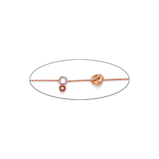 Minimalist and elegant bracelet by jnjbymadhuri, featuring a delicate chain adorned with circular and leaf-like charms in rose and white gold tones, perfect for a subtle yet sophisticated look.