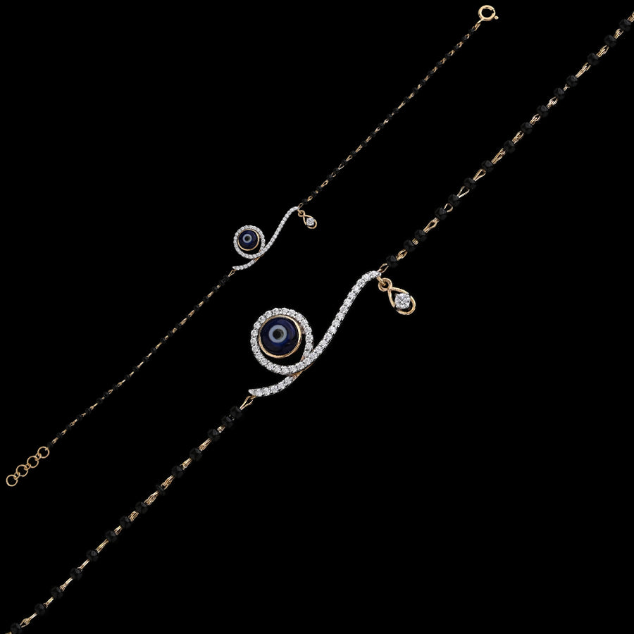 Elegant mangalsutra bracelet featuring a shimmering evil eye motif with delicate black beads, perfect for daily wear. A chic fusion of style and tradition by jnjbymadhuri.