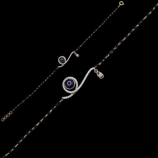 Elegant mangalsutra bracelet featuring a shimmering evil eye motif with delicate black beads, perfect for daily wear. A chic fusion of style and tradition by jnjbymadhuri.