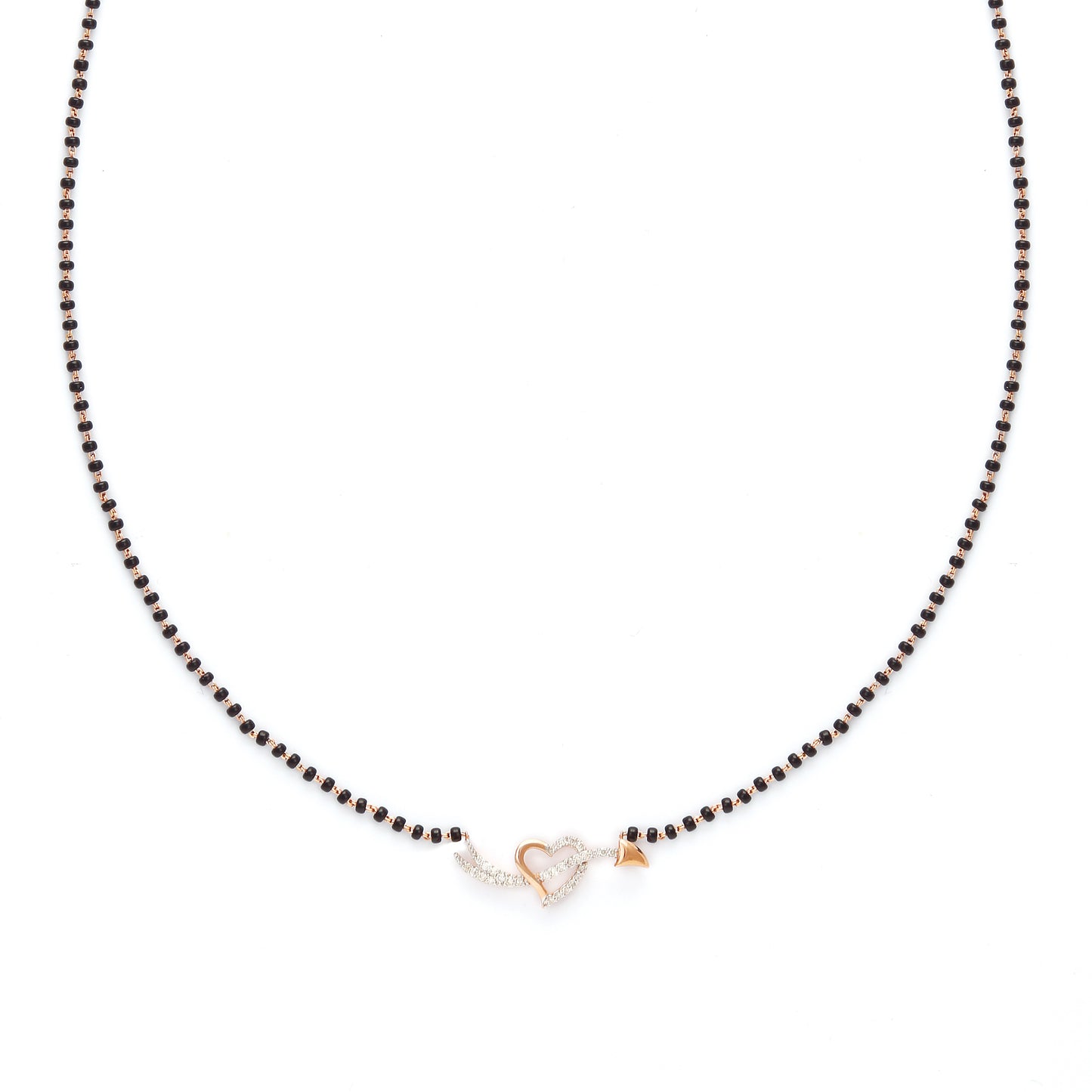 Delicate heart-shaped diamond mangalsutra pendant with classic black beaded chain, symbolizing timeless love. Crafted with elegance and grace by jnjbymadhuri.