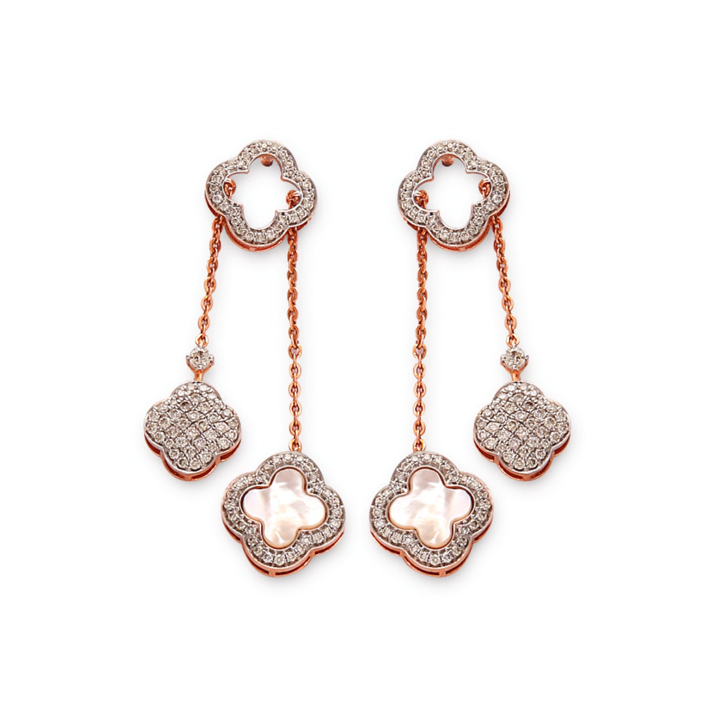 Delicate and graceful, these floral drop earrings showcase a stunning interplay of pearls and shimmering stones—an elegant statement from jnjbymadhuri.