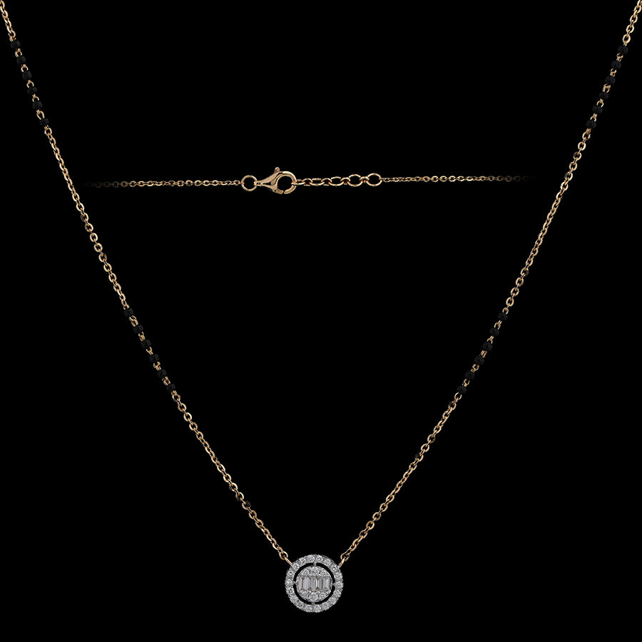 Elegant gold chain necklace with a round diamond pendant encased in a halo setting, exuding timeless charm. A delicate signature piece from jnjbymadhuri.