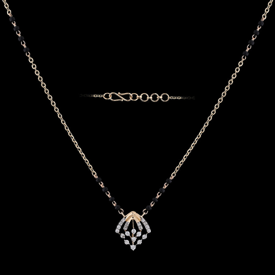 Elegant mangalsutra necklace featuring a delicate diamond-studded pendant and black bead detailing, perfect for modern traditional wear. This graceful design by jnjbymadhuri blends timeless charm with contemporary elegance.