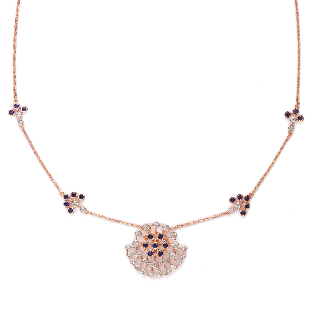 Elegant rose gold necklace featuring a central fan-shaped pendant adorned with black and white stones, complemented by matching floral accents along the chain. A signature creation by jnjbymadhuri, blending modern charm with timeless grace.