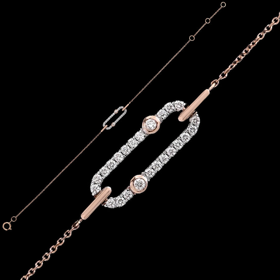 An exquisite designer bracelet by jnjbymadhuri, featuring an elongated oval centerpiece adorned with sparkling diamonds and accented by two bezel-set stones on either end—crafted in a harmonious blend of rose gold and white stones for a luxurious finish.