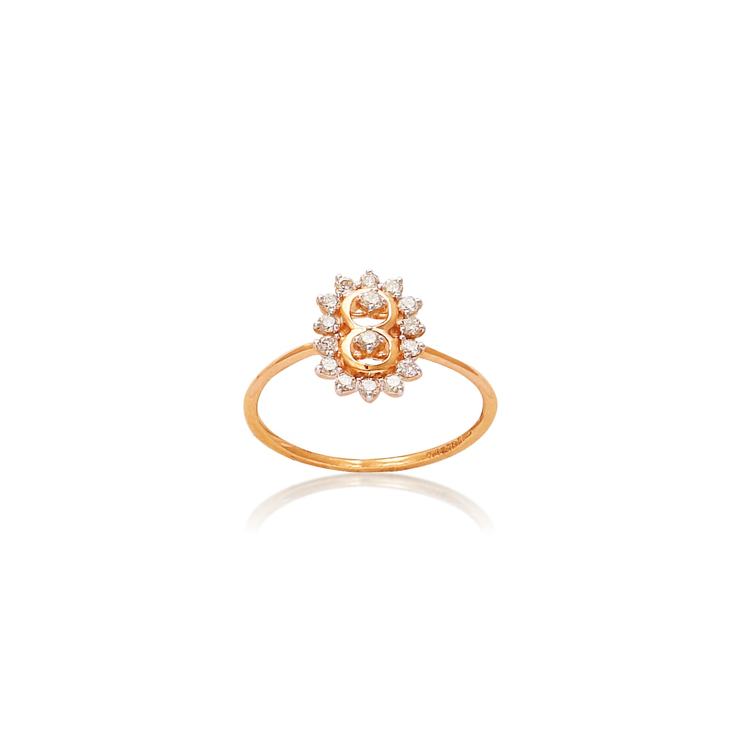 Delicate gold floral ring by jnjbymadhuri, featuring a central gemstone surrounded by a halo of shimmering diamonds in a blooming lotus design.