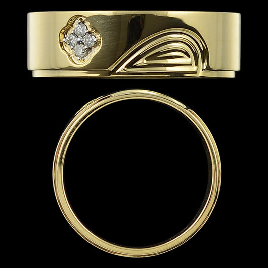 This elegant gold ring by jnjbymadhuri features a unique curved engraving beside a sparkling diamond accent, blending classic charm with modern artistic flair.