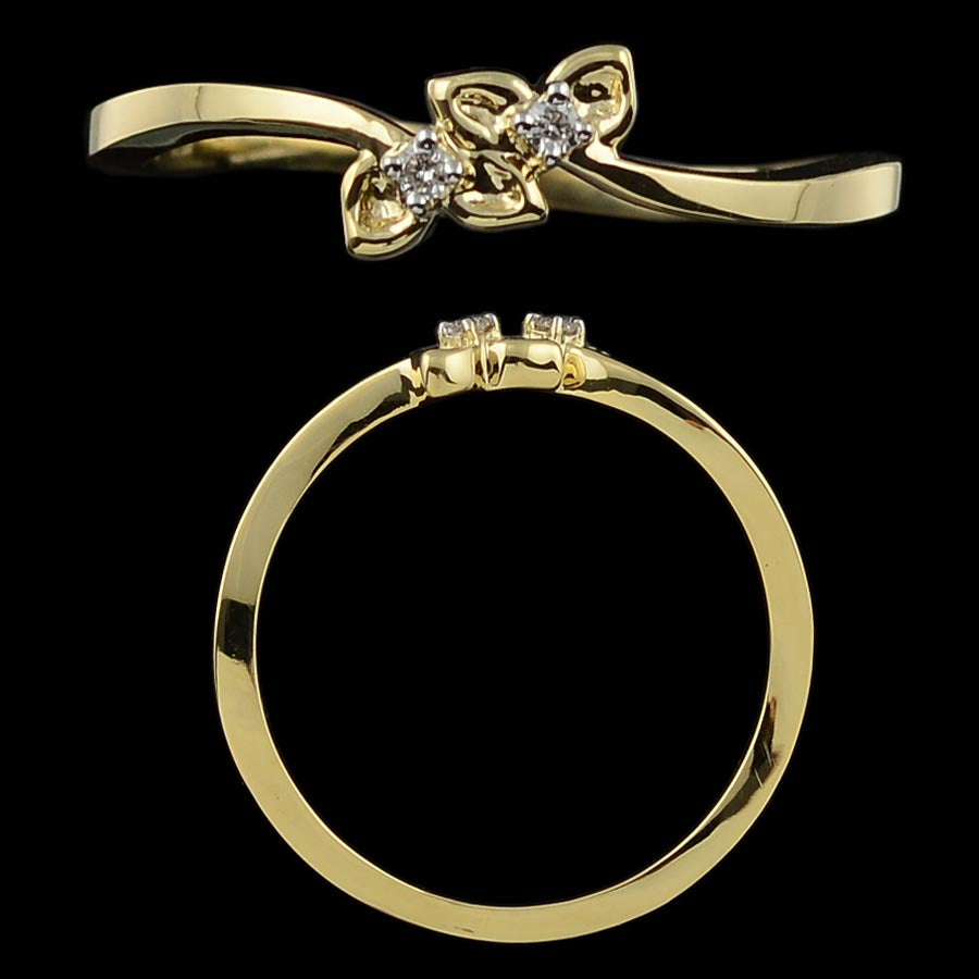 This ring features an elegant gold band with a delicate floral-inspired design at the center, adorned with two sparkling diamonds. The curved setting and petal-like detailing offer a graceful, nature-inspired aesthetic, perfect for someone who appreciates understated charm with a feminine touch.