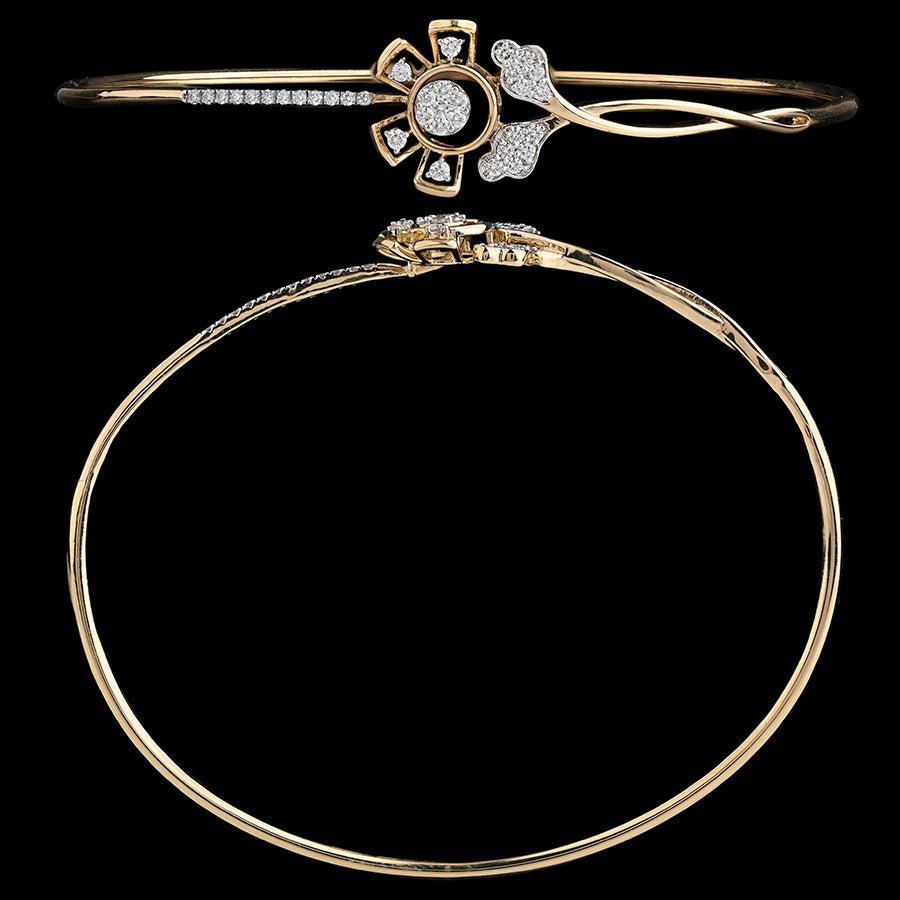 Elegant floral-themed gold bangle featuring petal-shaped embellishments and delicate stone detailing. An exquisite piece by jnjbymadhuri.