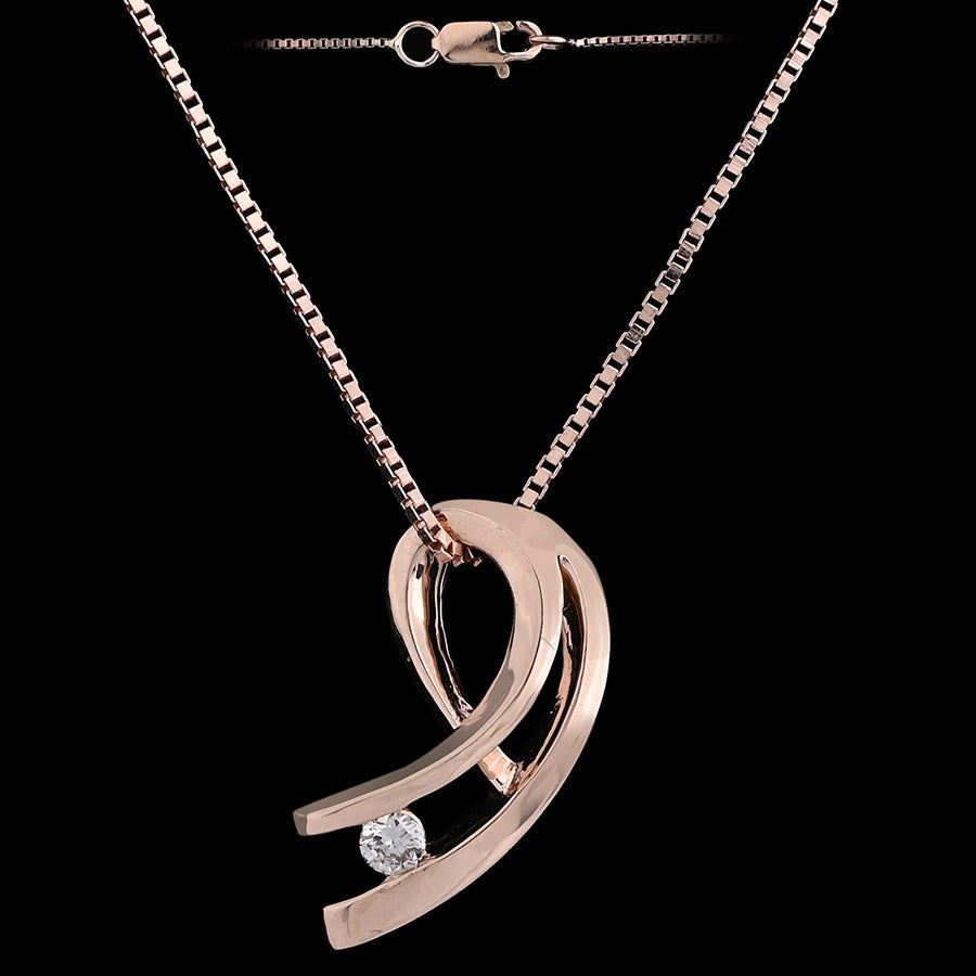 jnjbymadhuri rose gold necklace with a sleek, modern pendant featuring two curved bands forming an abstract design, accented by a single round white stone at the base, displayed against a black background.