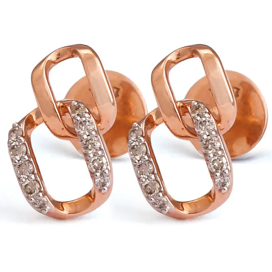 Rose gold earrings with interlinked oval loops, one studded with diamonds and the other in a polished finish, offering a chic modern look. A signature blend of elegance and style by jnjbymadhuri.
