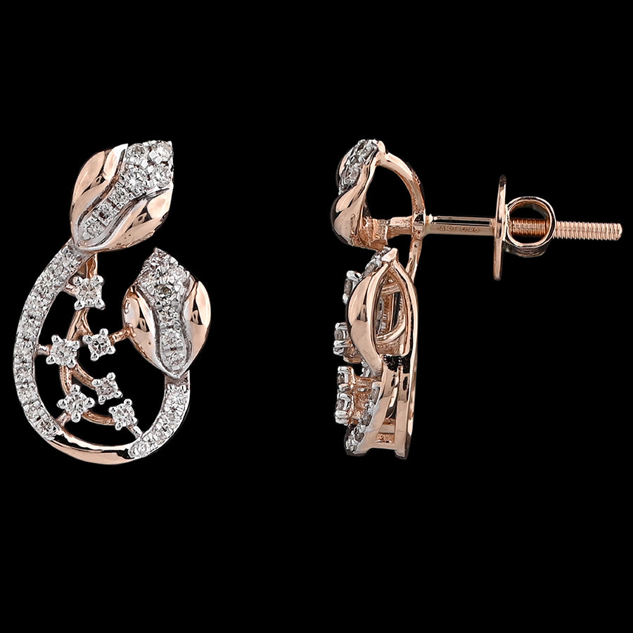 These stunning rose gold earrings feature a graceful teardrop design adorned with diamond-studded leaves and delicate vines, blending nature-inspired elegance with fine craftsmanship — a signature style of jnjbymadhuri.