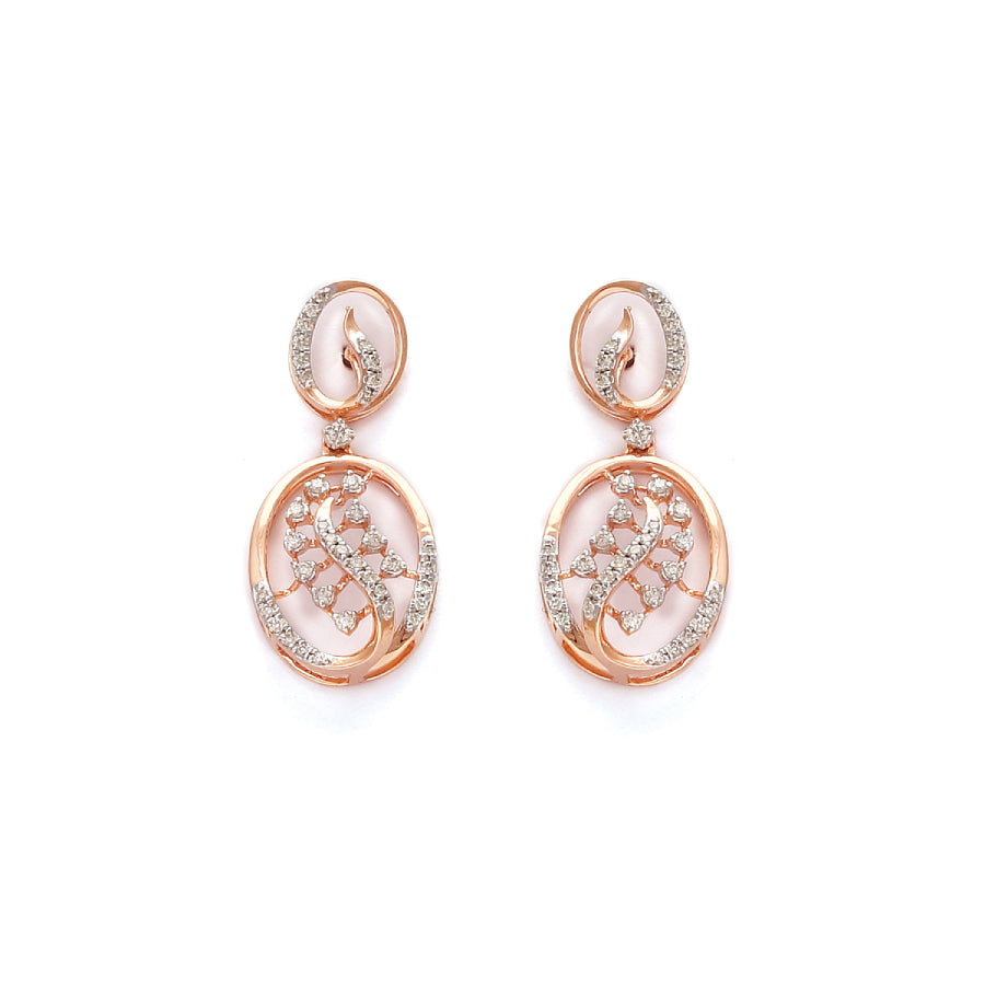 Graceful oval-shaped earrings in rose gold with intricate diamond accents and a modern twist design. A timeless piece from jnjbymadhuri.