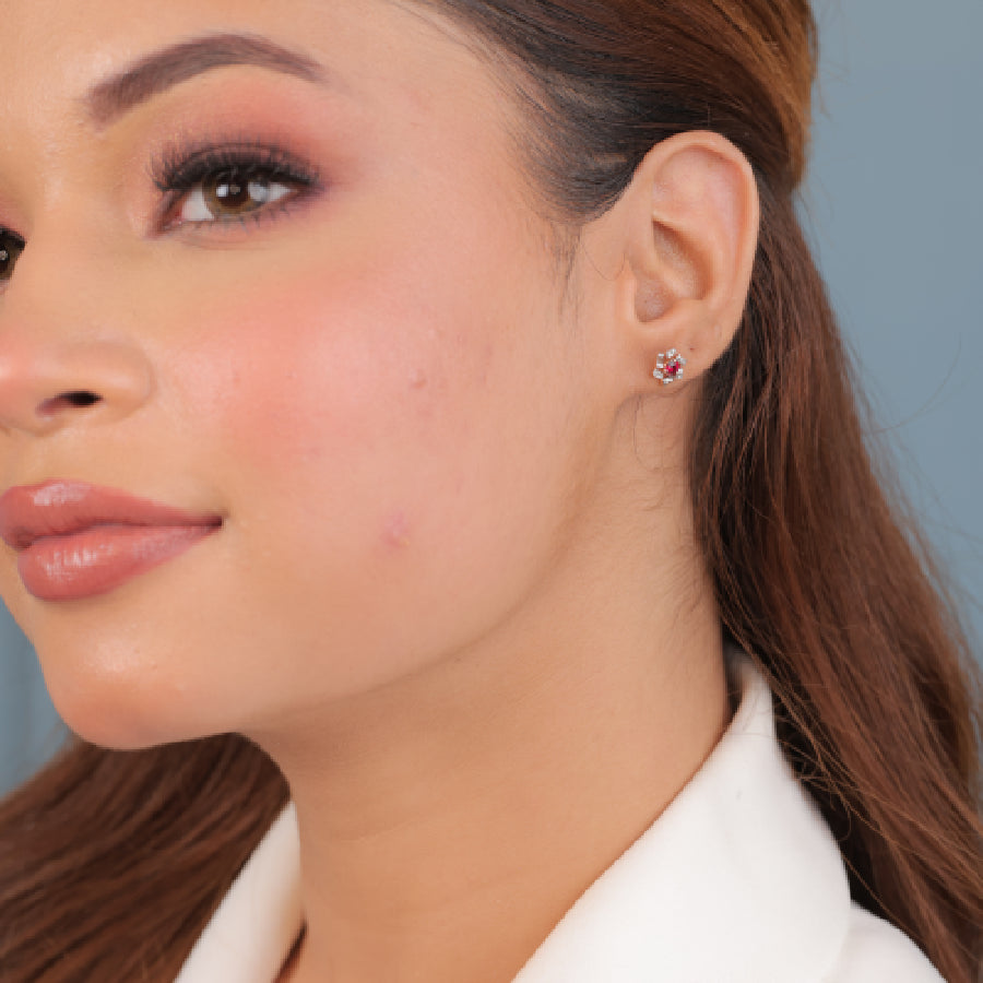 These stunning earrings by jnjbymadhuri blend timeless elegance with a modern twist. Featuring a rich red centerpiece, shimmering stones, and warm rose gold accents, they effortlessly enhance your everyday or festive look with subtle sparkle and grace.