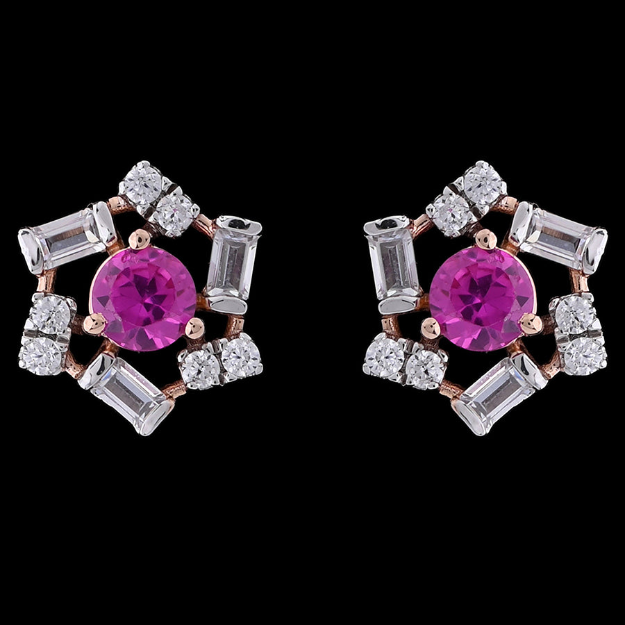 These floral-inspired earrings by jnjbymadhuri feature vivid fuchsia center stones surrounded by shimmering baguette and round-cut crystals in a delicate rose gold setting. A perfect blend of bold color and refined sparkle, ideal for both festive occasions and elegant everyday wear.