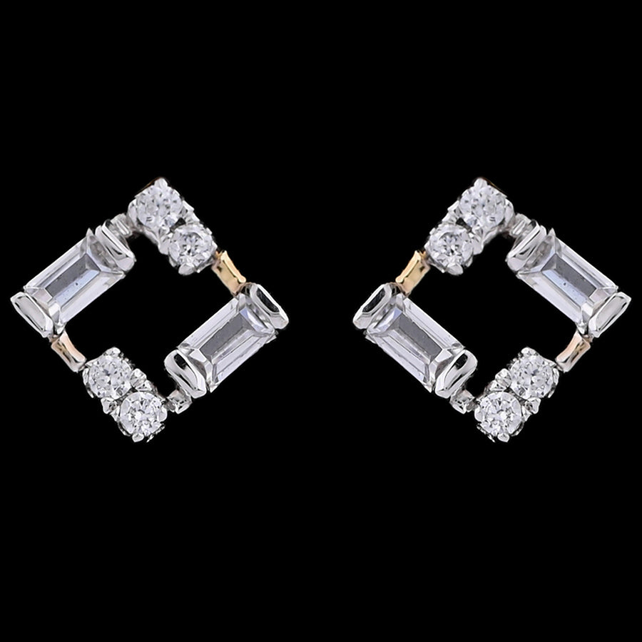 Geometric diamond stud earrings crafted in a square silhouette with alternating baguette and round diamonds. A bold and modern design by jnjbymadhuri.