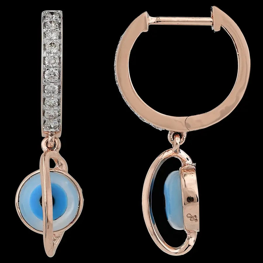Rose gold hoop earrings adorned with diamonds and a central blue evil eye charm, blending modern protection with elegance by jnjbymadhuri.