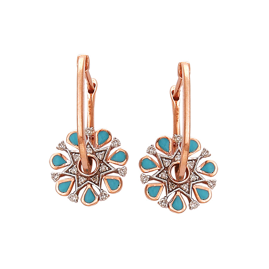 Chic floral-inspired earrings by jnjbymadhuri featuring turquoise enamel petals accented with sparkling stones in a rose gold setting. These vibrant designs by jnjbymadhuri bring a playful yet elegant flair to any outfit.