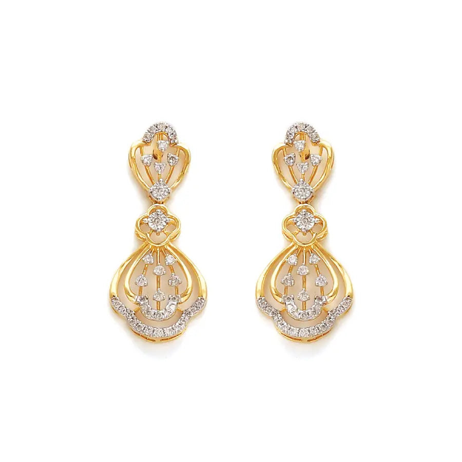 Graceful gold drop earrings adorned with intricate diamond accents in a floral-inspired design. A radiant statement piece from jnjbymadhuri.