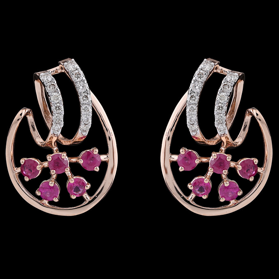 Rose gold earrings with dazzling diamond-studded curves and blooming pink floral gems, radiating charm and grace from jnjbymadhuri.