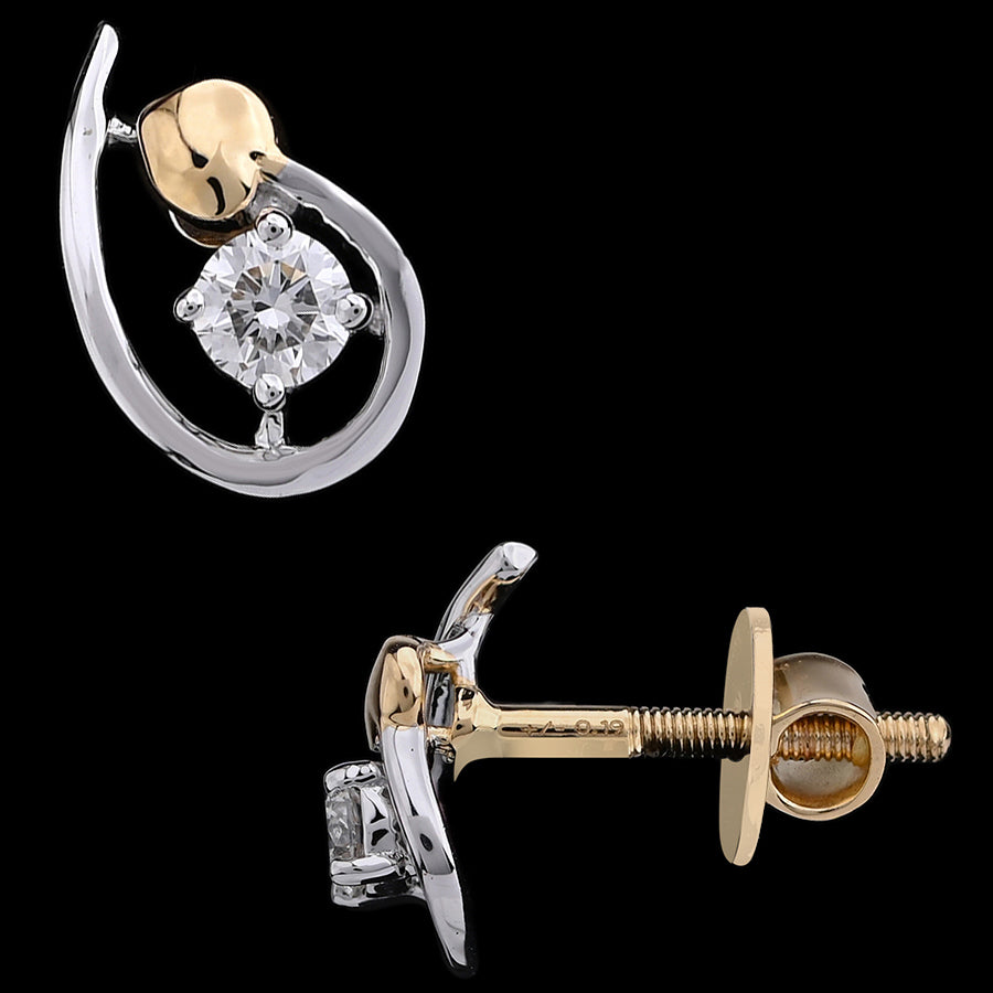 Chic two-tone gold earrings featuring a sleek teardrop design with a sparkling central diamond. A graceful blend of elegance and modern charm by jnjbymadhuri.