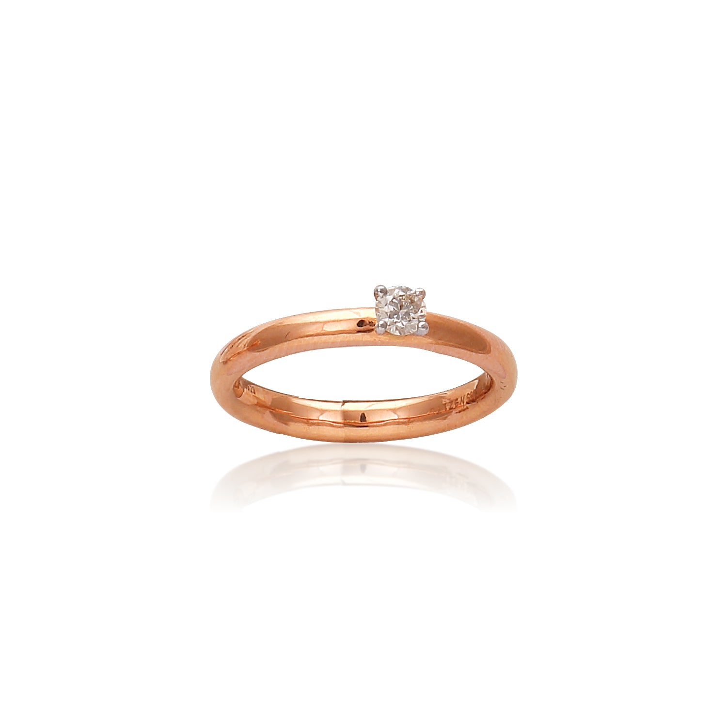 A classic rose gold solitaire ring featuring a brilliant-cut diamond, radiating elegance and charm. Perfectly designed by jnjbymadhuri, it captures timeless beauty in a minimalist style.