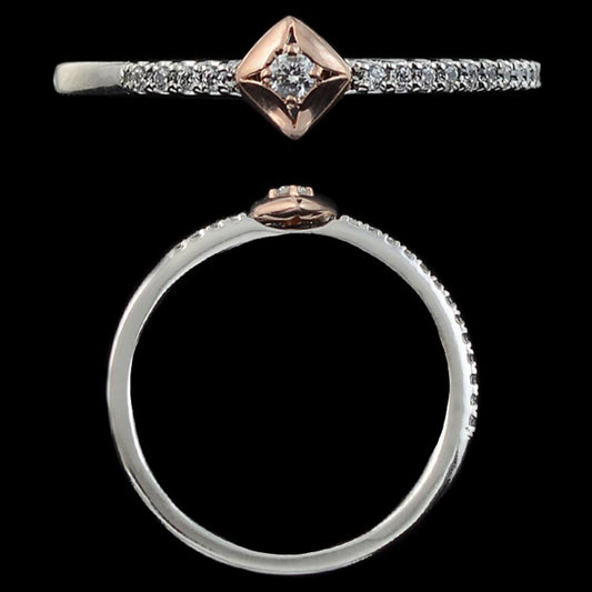 This elegant dual-tone ring by jnjbymadhuri features a sparkling central diamond in a rose gold square bezel, set on a slender silver band encrusted with tiny diamonds for extra brilliance.