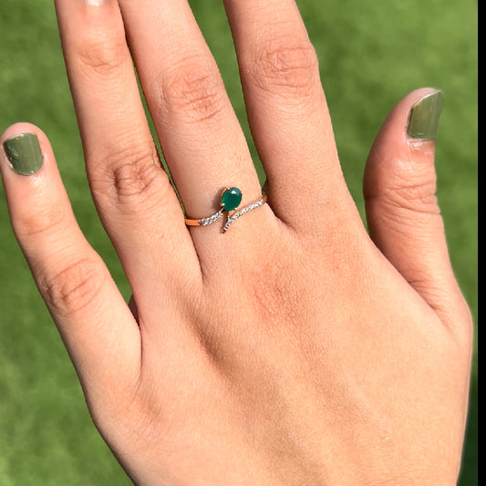 Minimalist green gemstone ring shining under natural light, highlighting effortless elegance and charm by jnjbymadhuri.