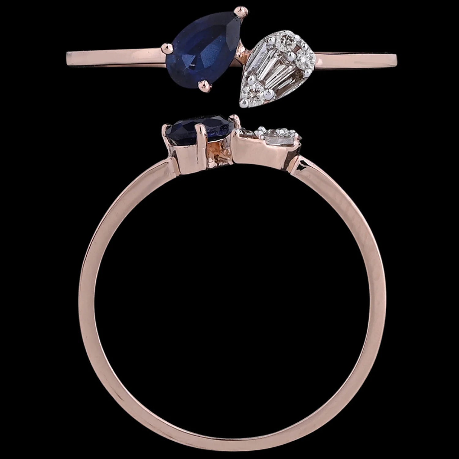 A rose gold ring from jnjbymadhuri featuring a unique open-top design with a pear-shaped deep blue sapphire and a pear-cut white diamond, set side by side in a modern and elegant style.