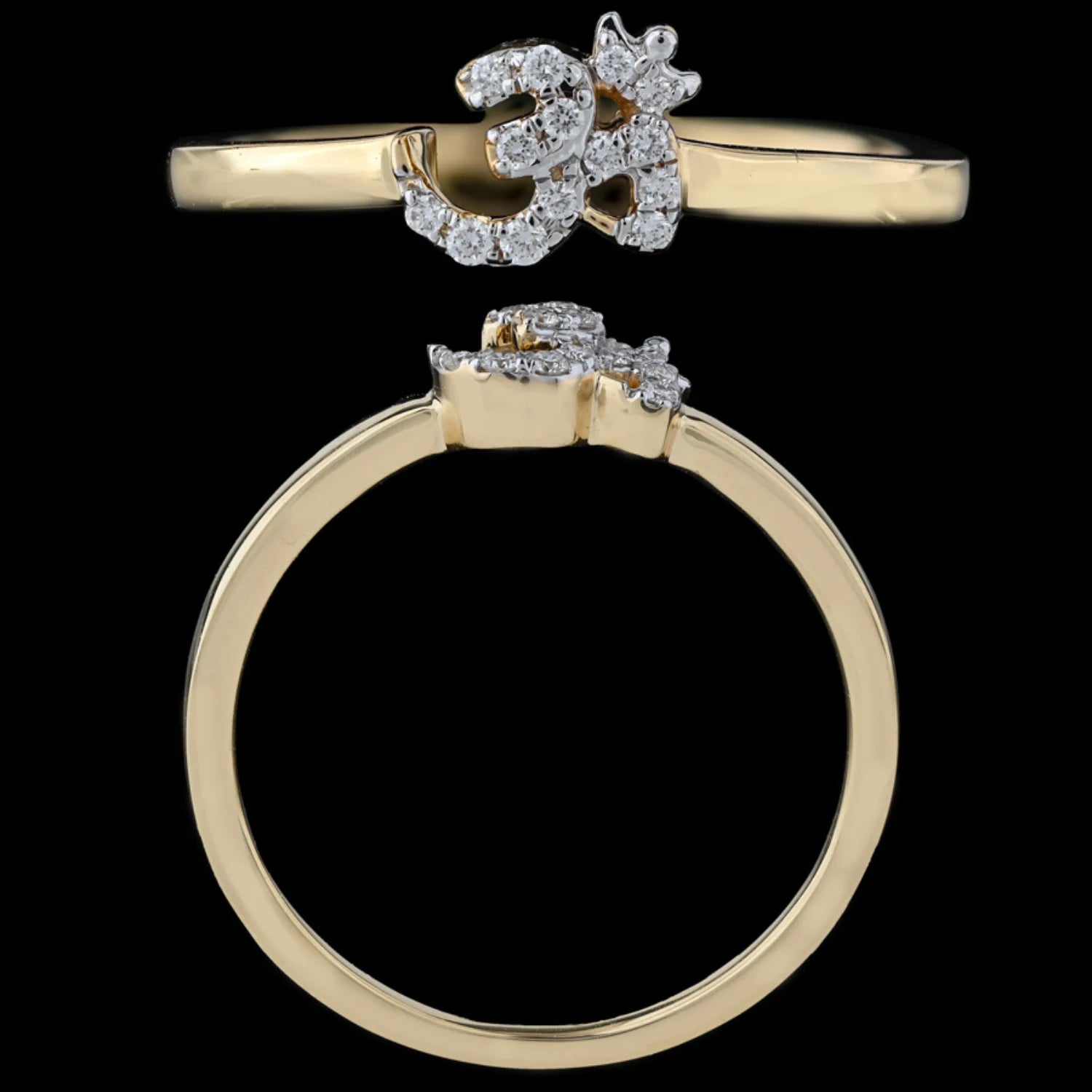 A stunning gold ring featuring a diamond-studded Om symbol design is captured against a solid black background, emphasizing its spiritual elegance and intricate craftsmanship, beautifully representing the essence of jnjbymadhuri.