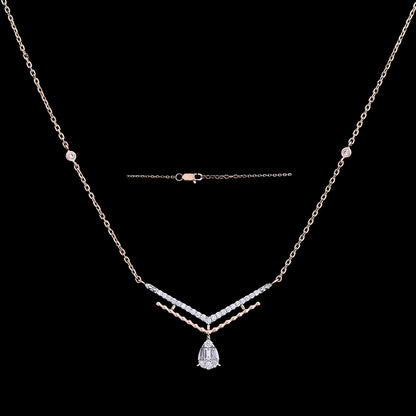 Elegant silver-toned necklace featuring a teardrop-shaped pendant and delicate detailing, perfect for a refined, modern look. Discover timeless beauty with jnjbymadhuri craftsmanship and style.
