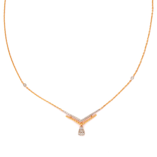 Refined gold-toned necklace featuring a sleek V-shaped design and a radiant teardrop pendant for classic charm. Grace your neckline with timeless elegance from jnjbymadhuri.
