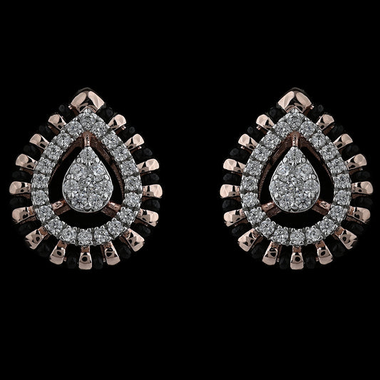 Elegant teardrop earrings encrusted with brilliant diamonds and bordered with rose gold accents for a regal look. A signature design by jnjbymadhuri.
