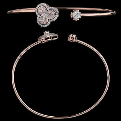 Elegant rose gold bangle featuring a clustered floral design and a sparkling stone accent, crafted with finesse by jnjbymadhuri.
