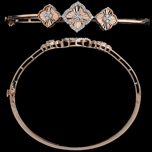 This exquisite bracelet from jnjbymadhuri features a trio of diamond-studded square motifs, each delicately outlined in rose gold. The central motif is adorned with a sparkling diamond pattern, offering a perfect blend of symmetry and elegance on a classic oval bangle.
