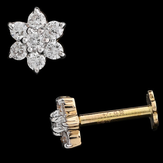 This floral stud earring features a symmetrical six-petal diamond cluster set in a delicate gold base, highlighting classic beauty and refined craftsmanship—another elegant creation from jnjbymadhuri.

