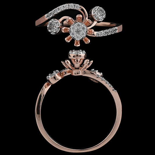 This floral-inspired rose gold ring features shimmering diamonds arranged in a graceful bloom design, radiating charm and sophistication. A signature creation by jnjbymadhuri that adds elegance to every gesture.
