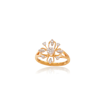 Elegant gold ring by jnjbymadhuri featuring a floral-inspired openwork design, embellished with pear and round-cut diamonds, displayed on a white background with a soft reflection below.
